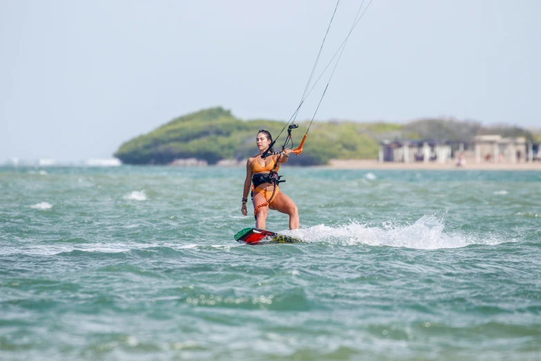 a woman water skiing in the ocean with 