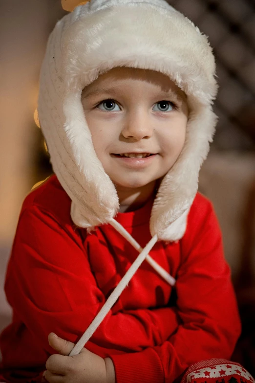 a  wearing a white hat on top of his head