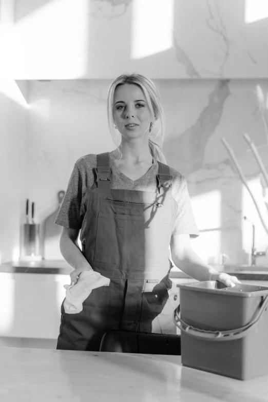 a woman that is standing in front of a pan