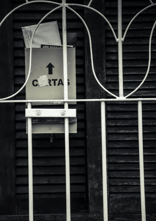 an arrow pointing right up through a gate