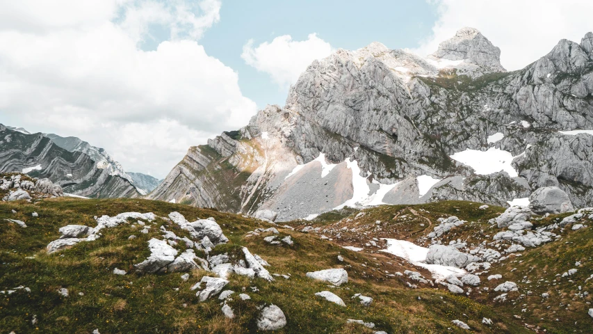 a mountain is pictured against a cloudy sky