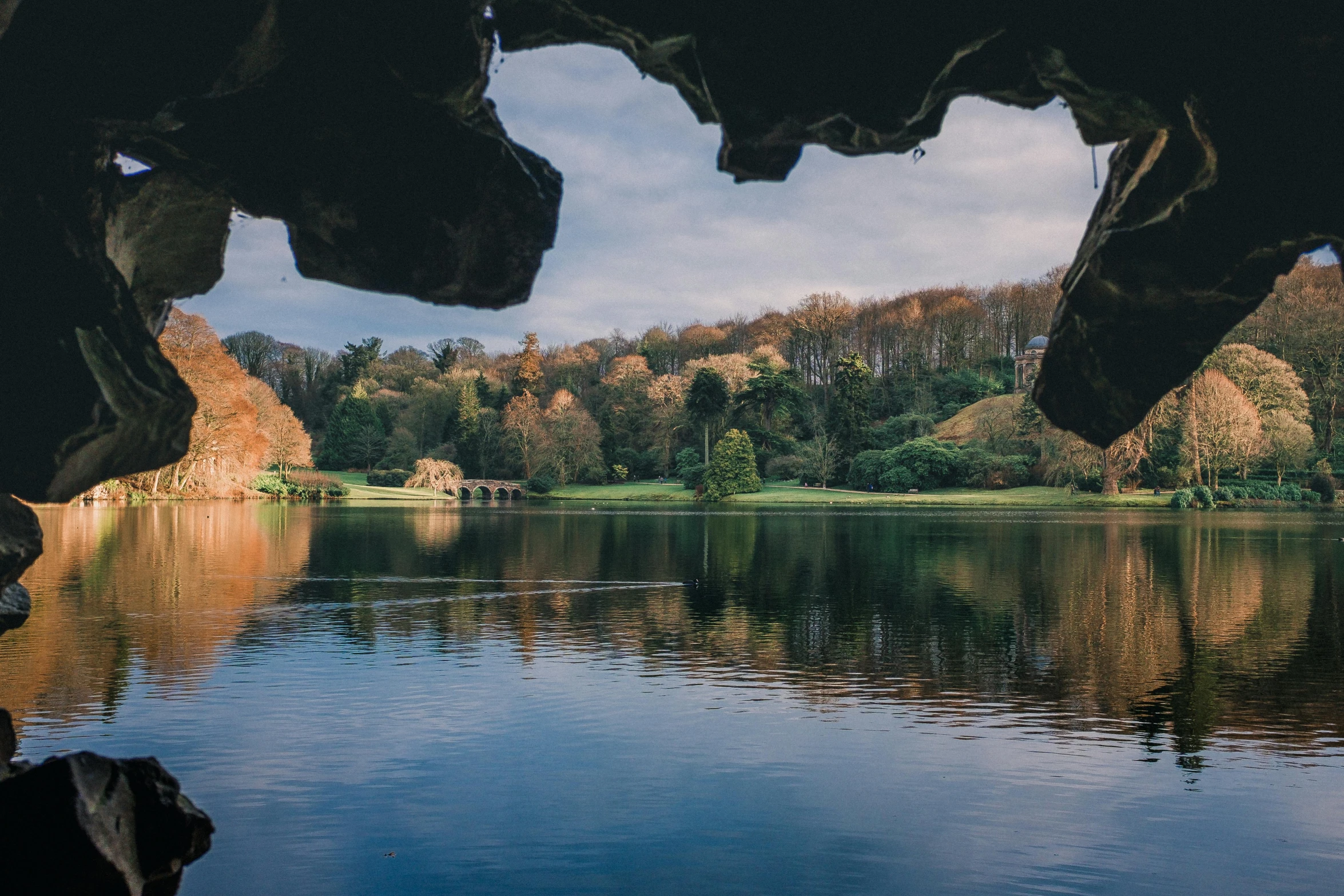 a lake with a bunch of water on the shore