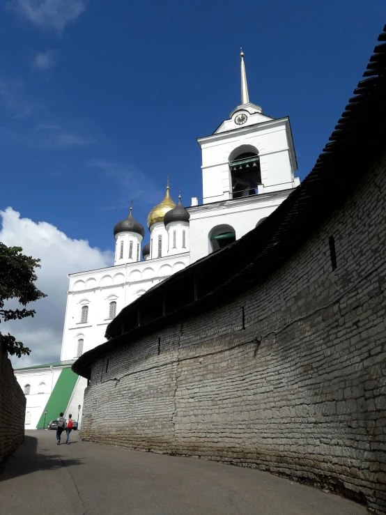 a white building with gold dome and steeples