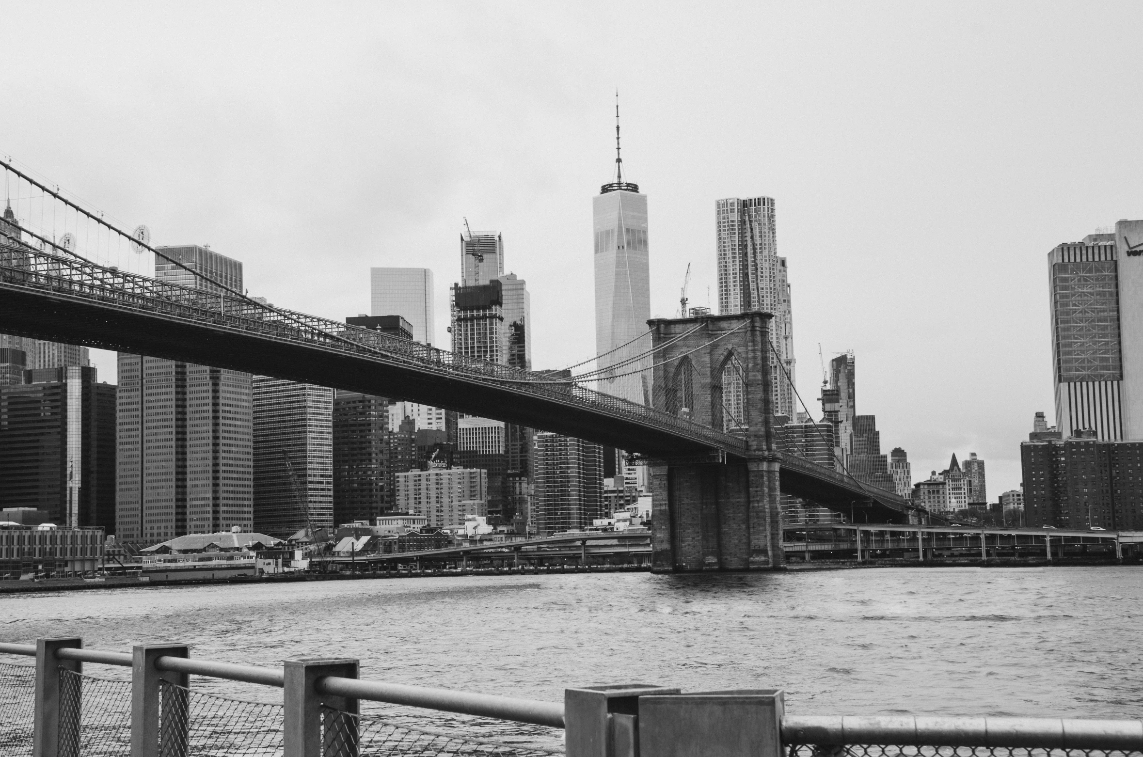 new york city skyline with the brooklyn bridge overpass