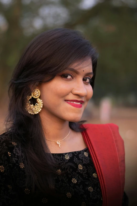 a woman in red posing for a po