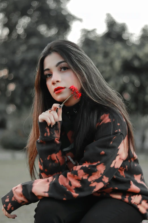 a woman with painted on her face is posing for a picture