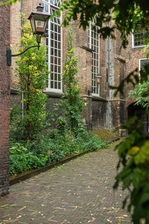 a view of a brick building with a clock on the side