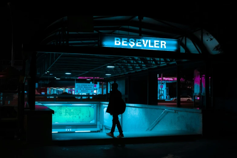 person walking in night scene with bar and clock
