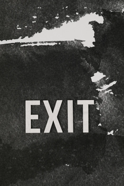 a black and white picture of a wall with the word exit written on it