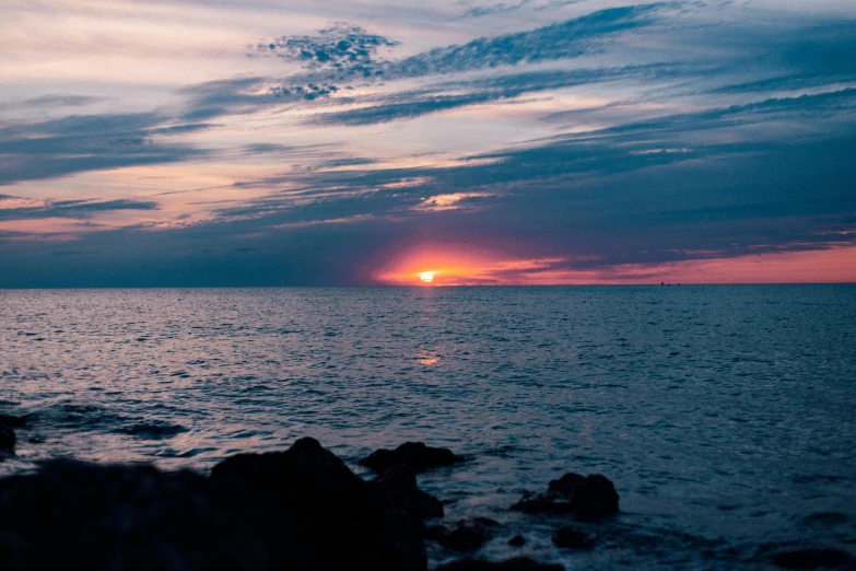 there are waves in the water at sunset