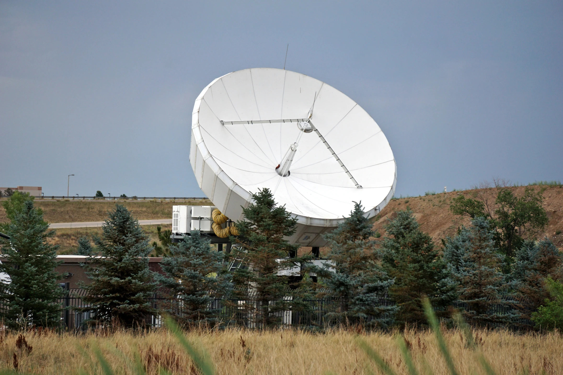 a large array of dishes in a field