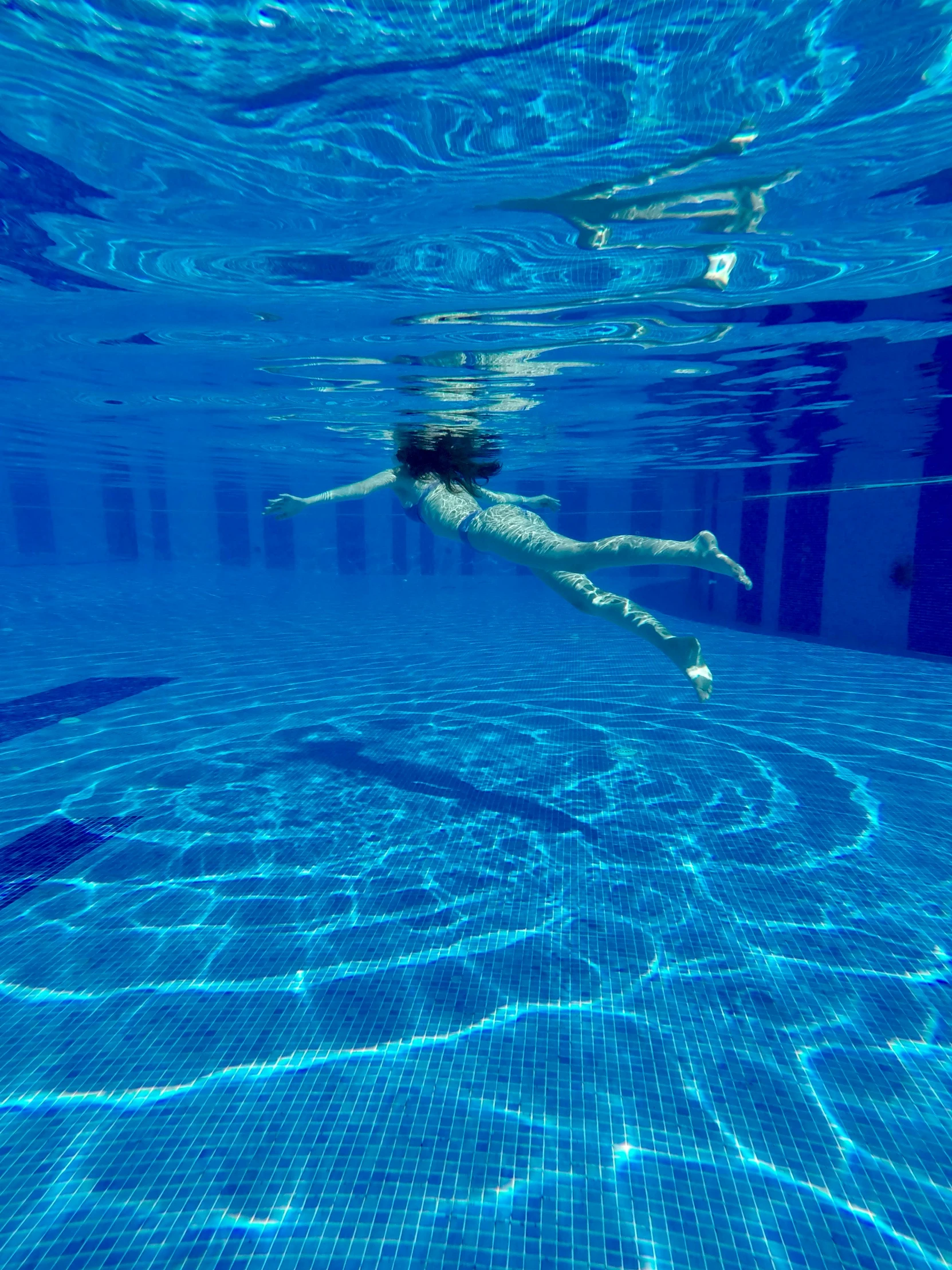 an underwater po of a person swimming