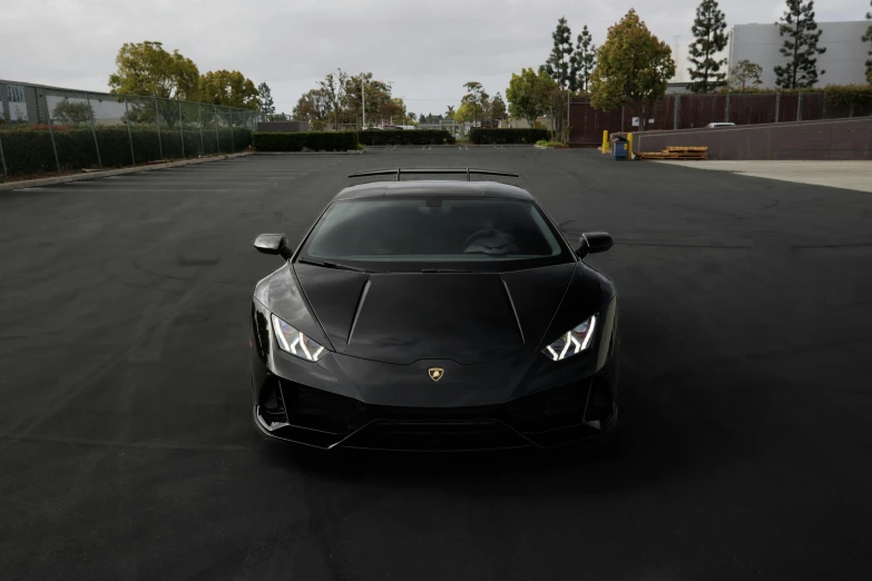 this is a dark colored car parked in a parking lot