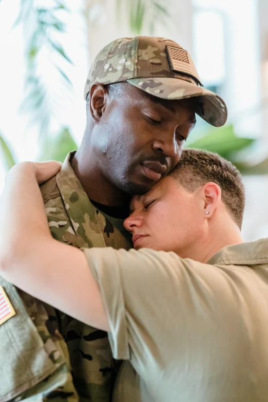 an officer emces a teenage boy with his arm around him