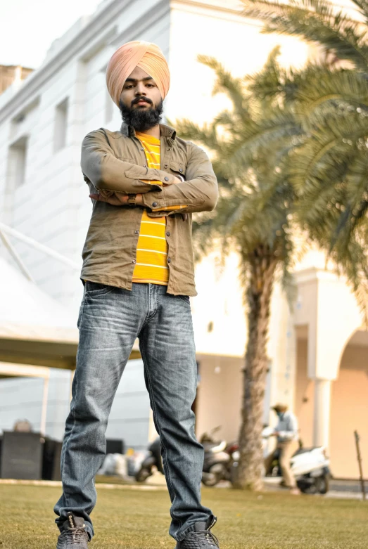 a man wearing a turban and jeans