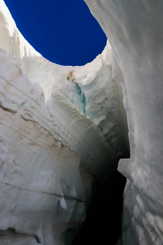 a view of a glacier seen from the inside of an ice cave