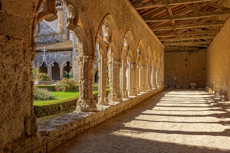 a very long and narrow walkway between some buildings