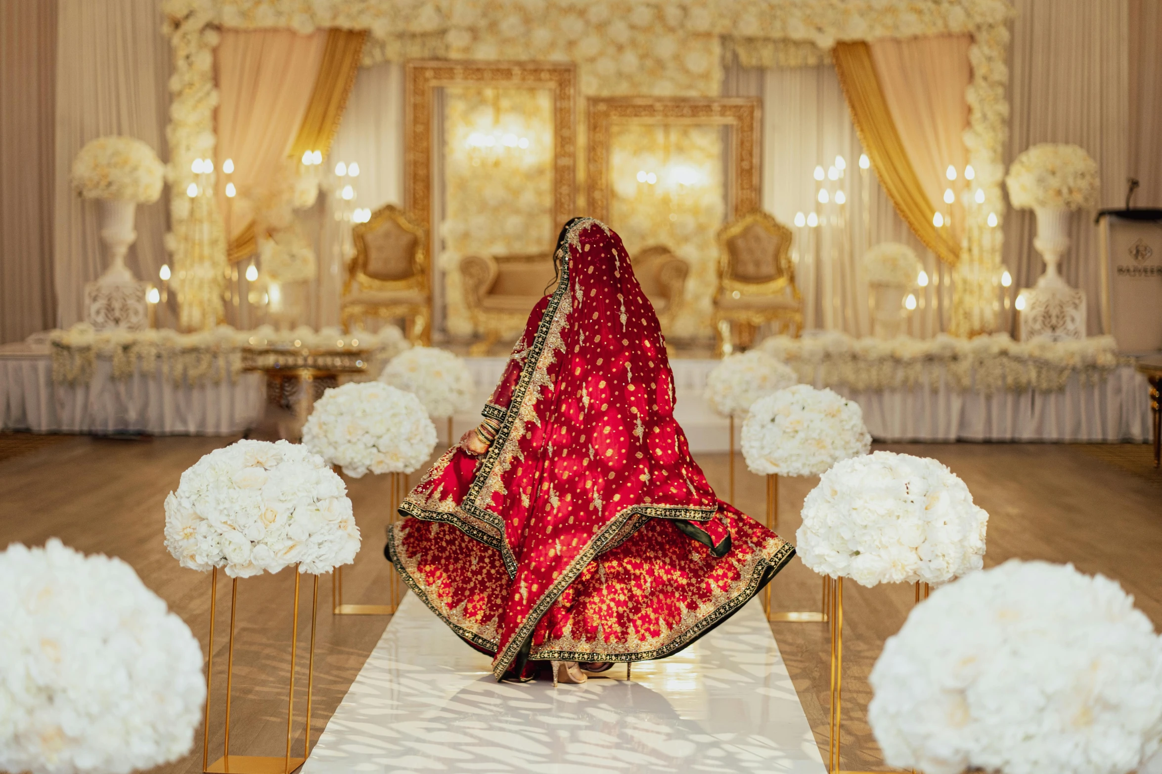 the centerpiece has a red cloth covered saree