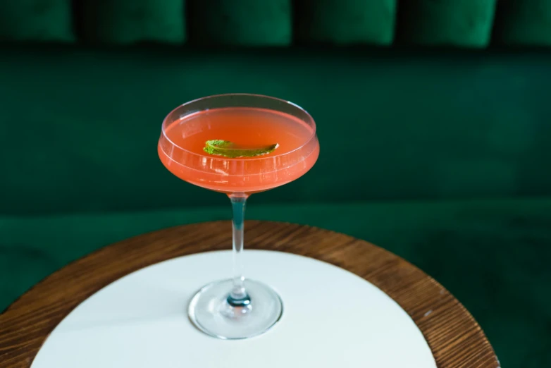 a glass sitting on top of a table filled with drinks