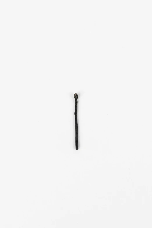 an object made out of a black cane with several holes in it