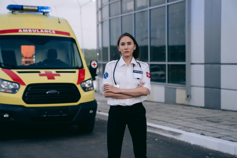 a female ambulance officer in a white shirt