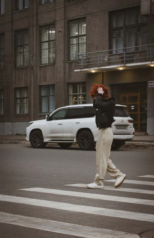 a white vehicle is traveling down a road