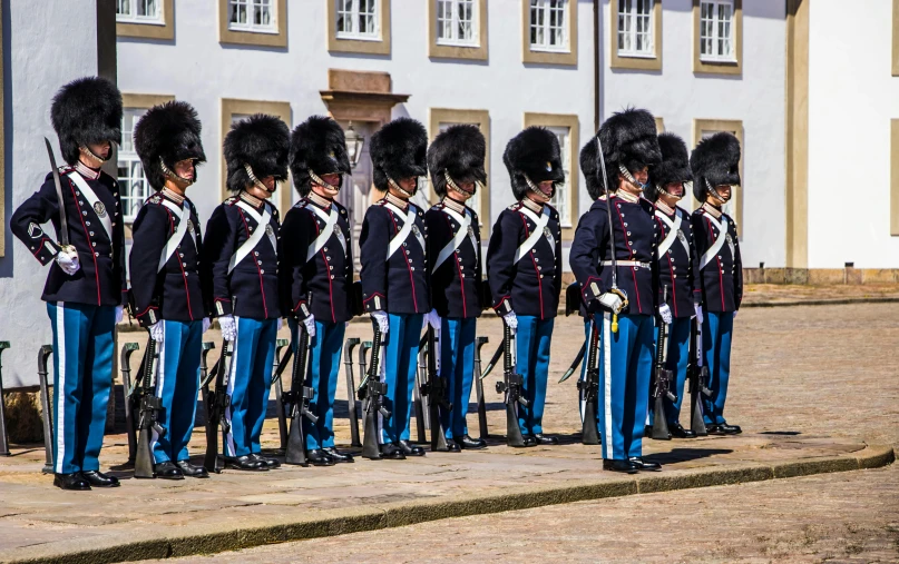 a group of people in uniform posing for the camera