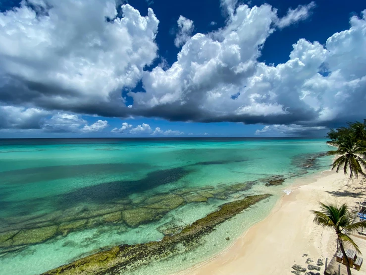 an aerial view of the beach in the afternoon