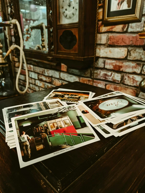 a table topped with pictures and other decor items