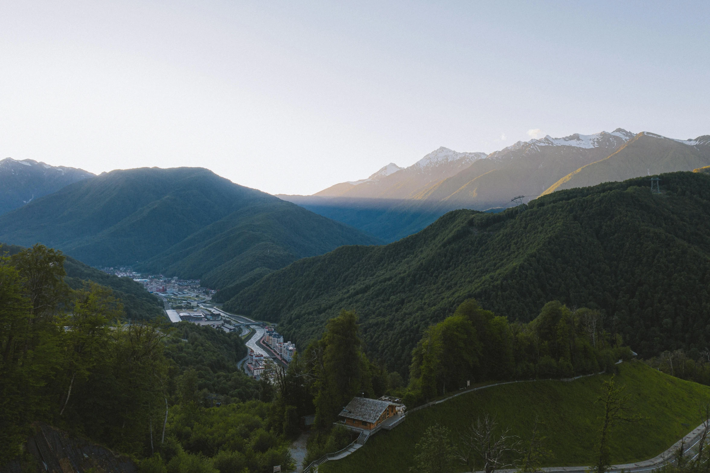 a valley with a few mountains in the background