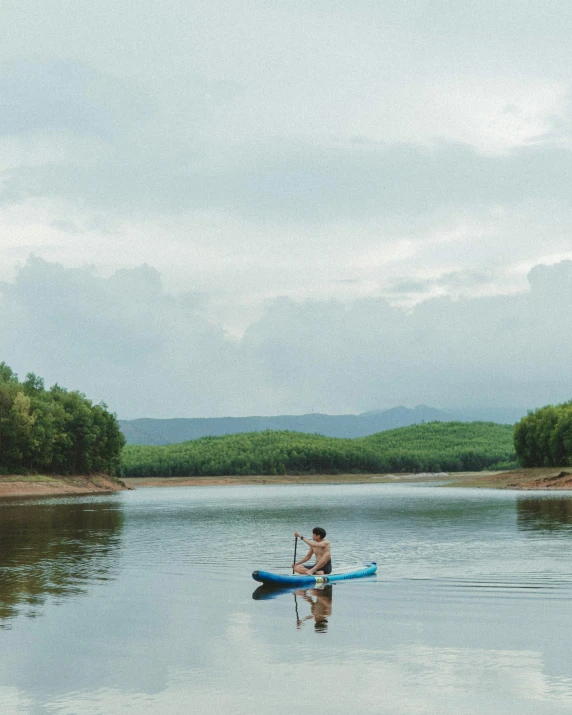 a person in a kayak out on the water