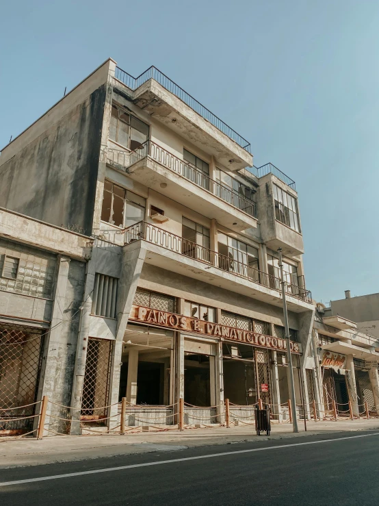 a long building with three stories and balconies