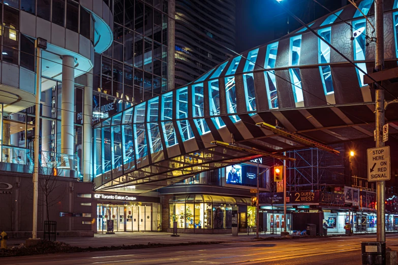 a modern building lit up at night, it looks like the inside of a curve