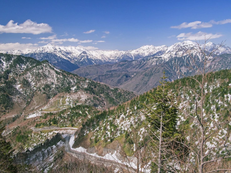 a scenic view of a mountain range is pictured in the foreground