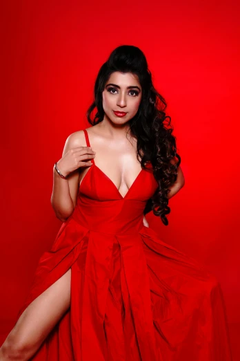 an image of a woman in red dress posing