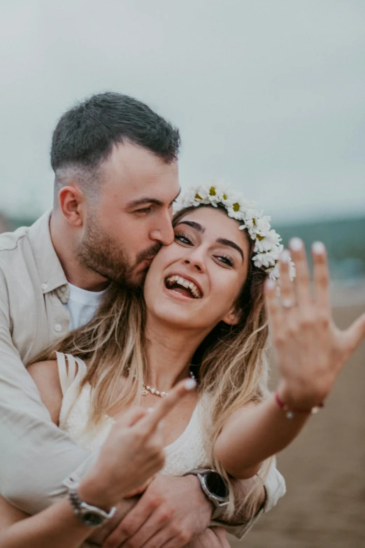 a couple that is standing in the dirt