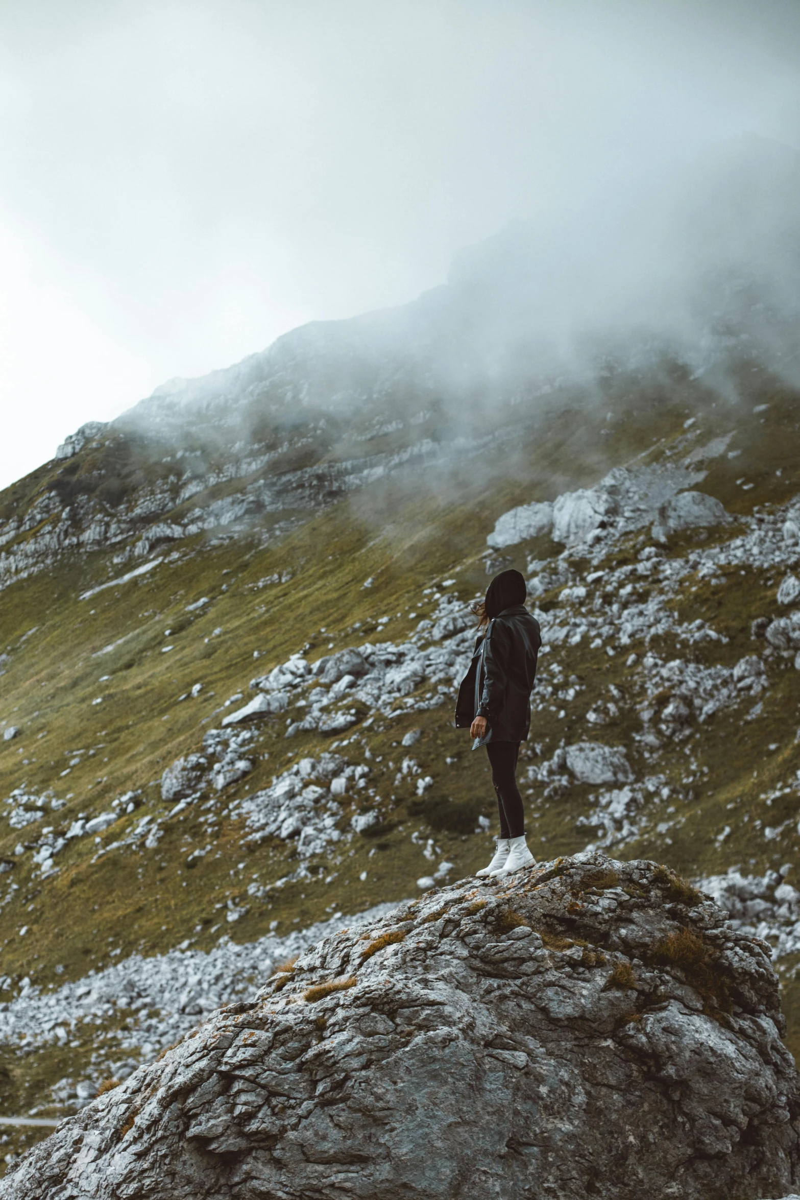 a person on top of a rocky hill