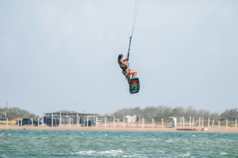 the person is wind surfing in the ocean