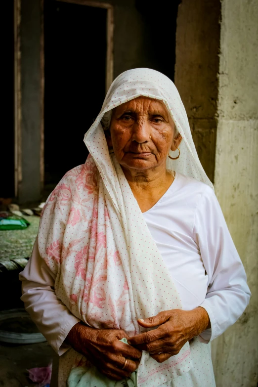 an old woman with a white veil