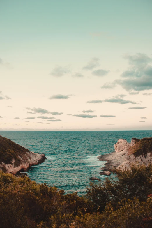 an ocean cliff with the ocean beyond