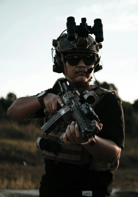 a person dressed in uniform aiming a gun