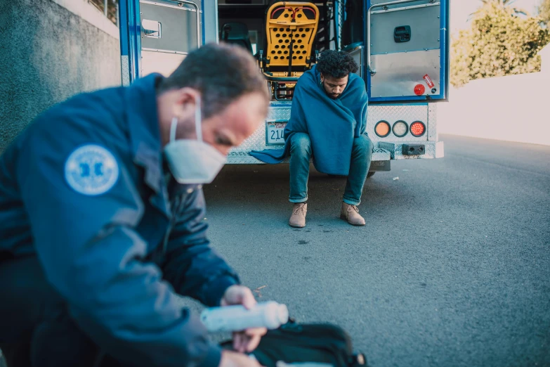 a man in the street getting off of a vehicle