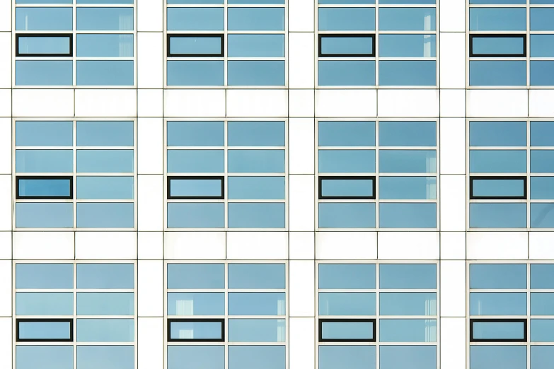 a tall building with windows that have horizontal lines