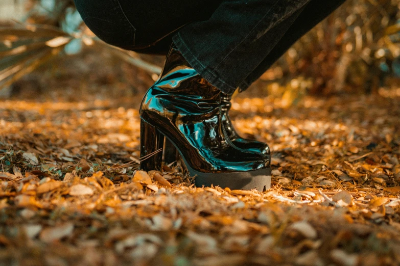 a pair of blue jeans wearing black heels and pants