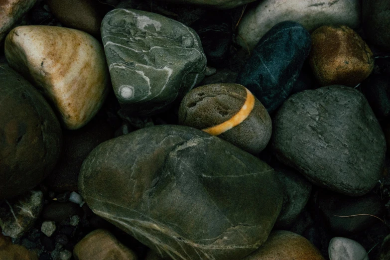 a pile of rocks with various designs on them