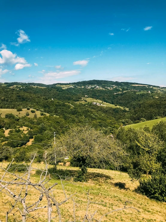 a view looking across the hills from a hilltop