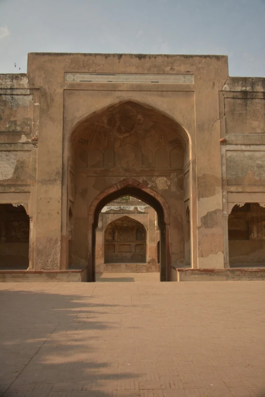 an archway and doorway in an old adobe building