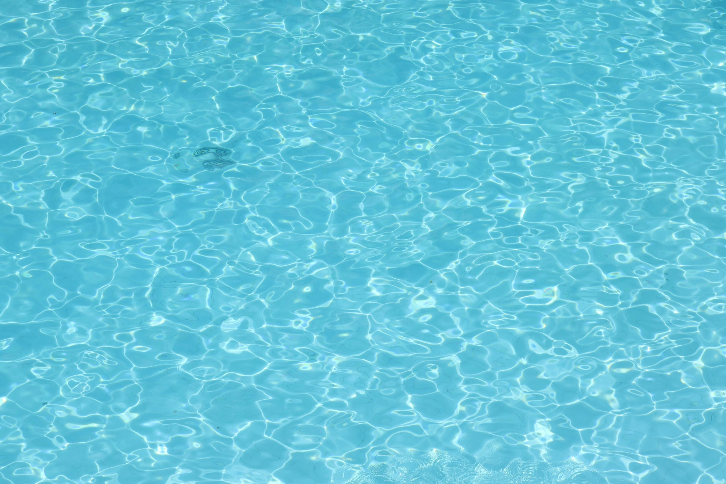 a pool has clear water with no ripples