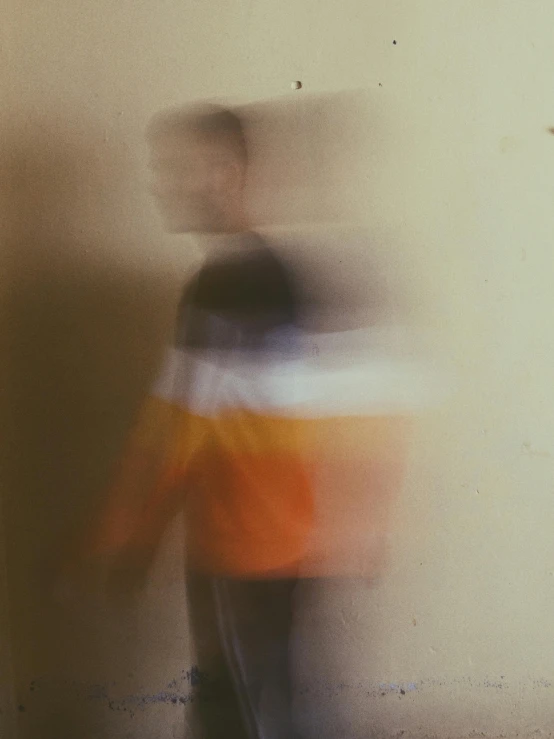 the blurred image shows the blur of the person