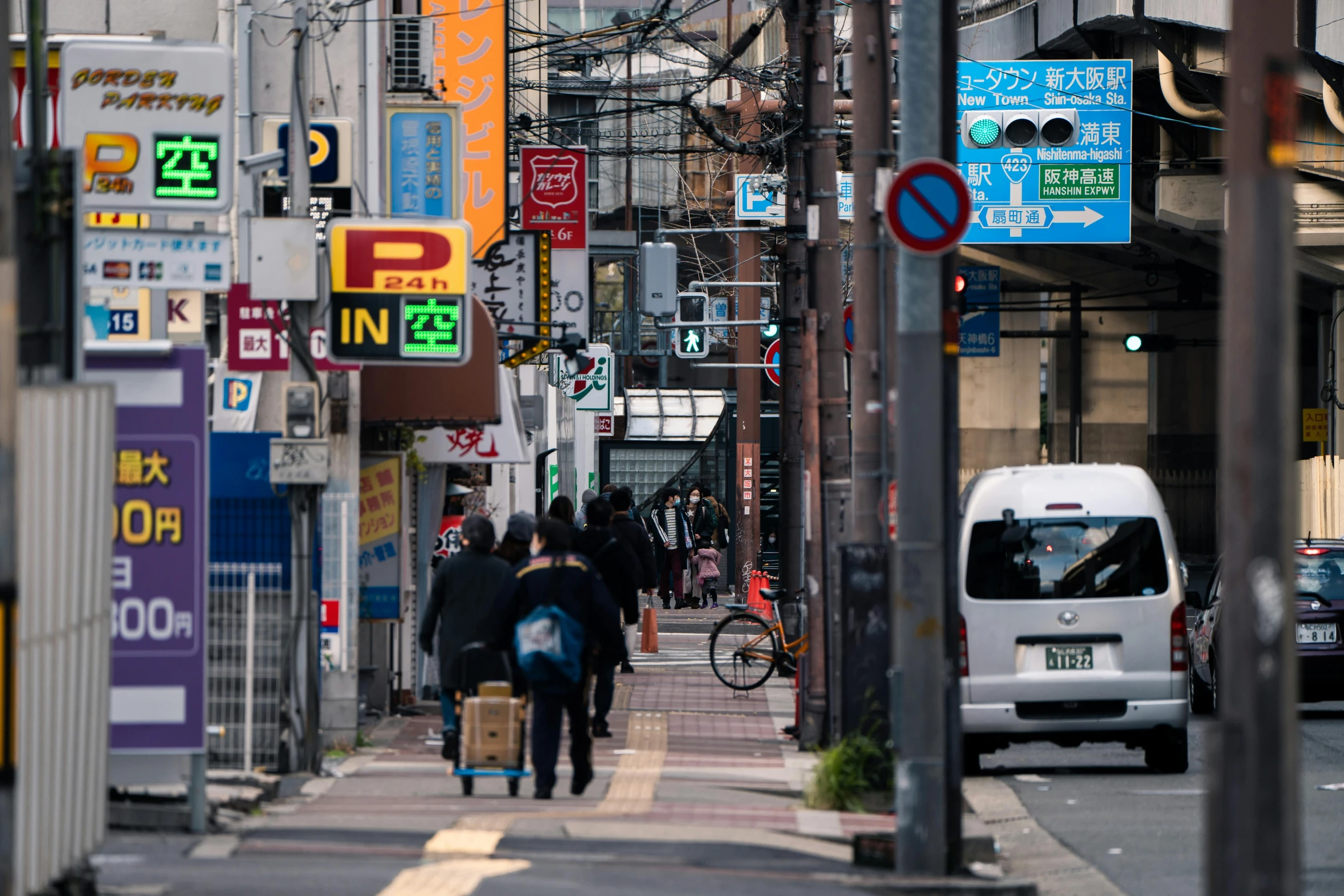 a group of people that are walking down a street